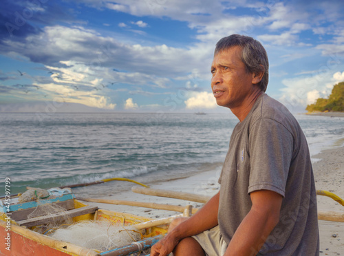 Waiting for sunset and the fish. Traditional fisherman, Aninuan, Oriental Mindoro, the Philippines, 2021. No fish, no money, no food. Poverty!