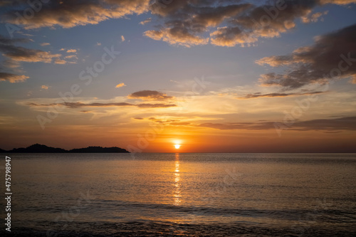  Beautiful scene of seascape during the sunset time. Very nice clouds and sun light at the beautiful beach of Thailand.