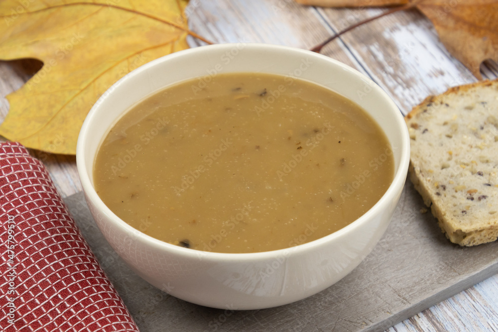 homemade cream soup with bread slices on table homemade cream soup with bread slices on table