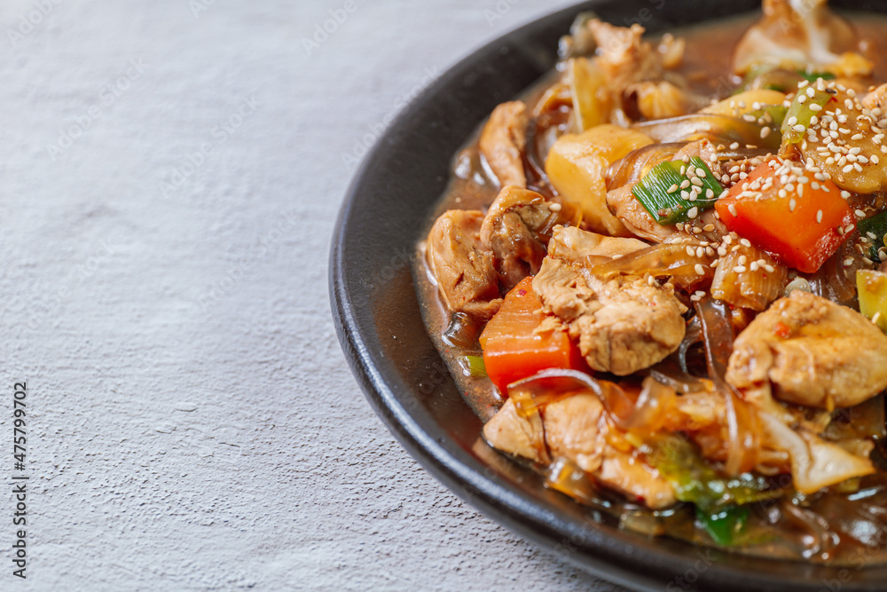 Andongjjimdak, Andong-style spicy stewed chicken : Originally from the Andong region, this dish consists of chicken, chili peppers, potatoes, clear noodles, leeks and carrots braised in a spicy sauce Andongjjimdak, Andong-style spicy stewed chicken : Originally from the Andong region, this dish consists of chicken, chili peppers, potatoes, clear noodles, leeks and carrots braised in a spicy sauce