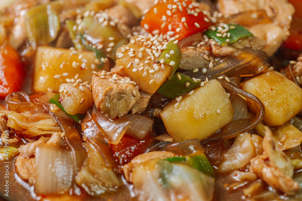Andongjjimdak, Andong-style spicy stewed chicken : Originally from the Andong region, this dish consists of chicken, chili peppers, potatoes, clear noodles, leeks and carrots braised in a spicy sauce Andongjjimdak, Andong-style spicy stewed chicken : Originally from the Andong region, this dish consists of chicken, chili peppers, potatoes, clear noodles, leeks and carrots braised in a spicy sauce