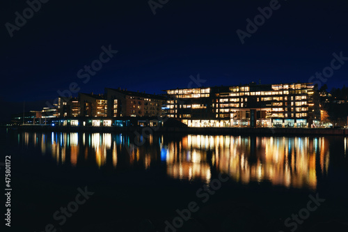 Lysaker Brygge by night. Long exposure to smooth out the water and to capture the dark parts without noise. Shot at Oslo, Norway, from the Bygdøy side Sollerud boat building.  © SteinOve