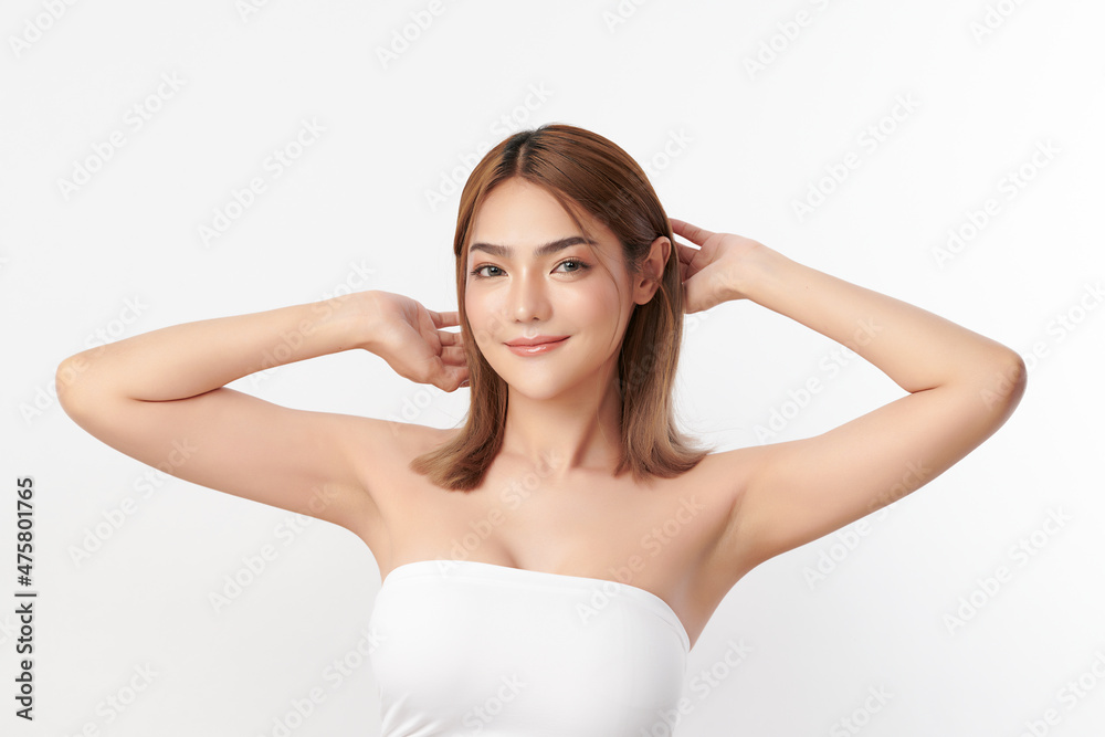 Beautiful Young Asian woman lifting hands up to show off clean and hygienic armpits or underarms on white background, Smooth armpit cleanliness and protection concept Beautiful Young Asian woman lifting hands up to show off clean and hygienic armpits or underarms on white background, Smooth armpit cleanliness and protection concept