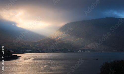 Dramatic cloudy landscape scenery with sunbeam coming trough clouds at Killary fjord in county Mayo, Ireland 