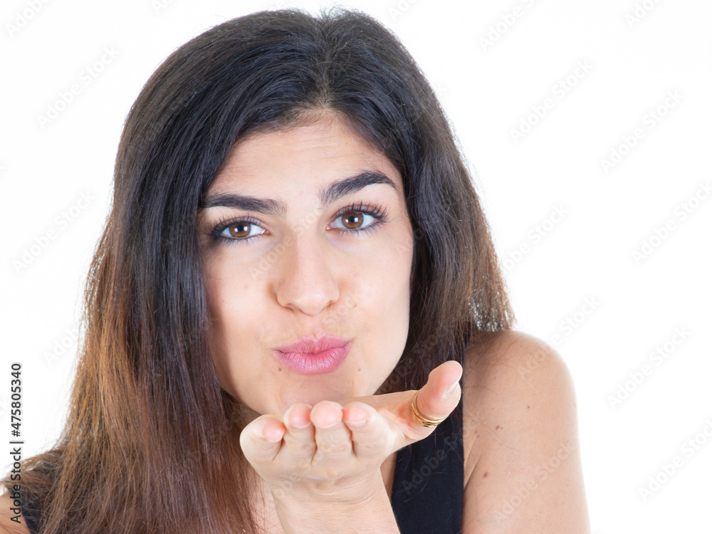 beautiful woman sending a kiss kisses in the air in portrait on white background beautiful woman sending a kiss kisses in the air in portrait on white background