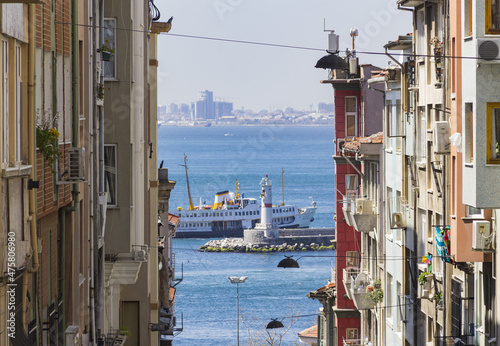 Scenic view of a boat in between two residential buildings in Kadikoy, Turkey