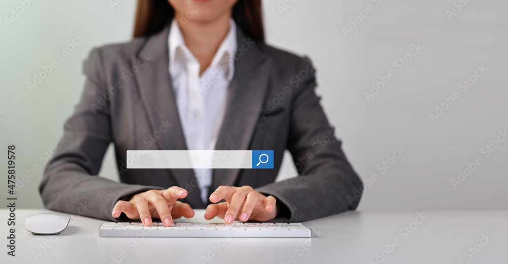 Attractive female hands using laptop computer keyboard searching, browsing internet data online information with search bar console interactive on screen. Lifestyle with technology Attractive female hands using laptop computer keyboard searching, browsing internet data online information with search bar console interactive on screen. Lifestyle with technology