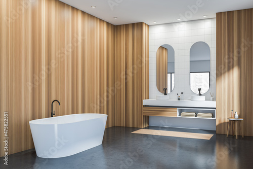 Bathroom interior with bathtub  sink and mirror  concrete floor. Empty wall