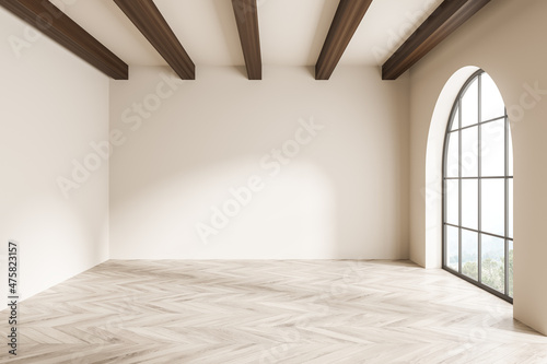 Arch window in beige living room with empty interior photo