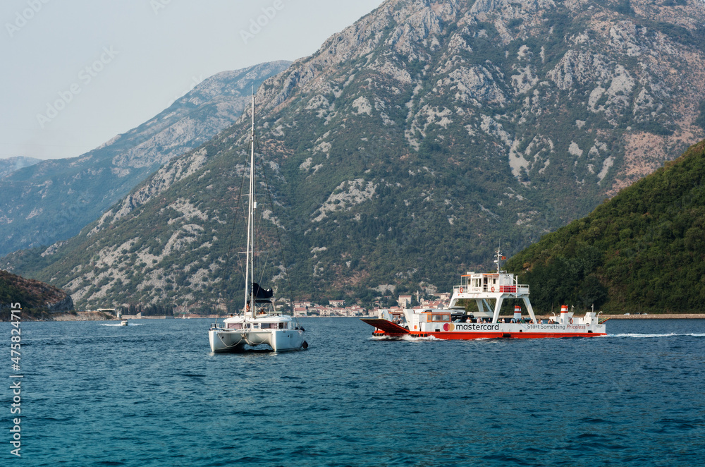 Bay of Kotor, view from the sea to the boats near old town of Herceg Novi in Montenegro, Europe, Adriatic Sea and mountains