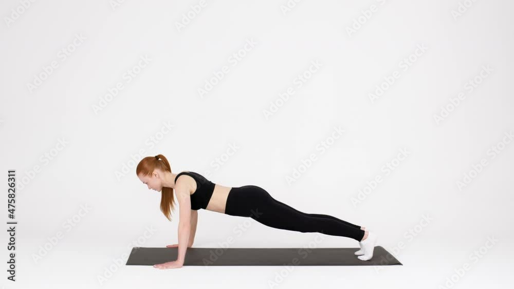 Fitness Workout. Sporty Young Woman Doing Push Ups Exercises In Studio Fitness Workout. Sporty Young Woman Doing Push Ups Exercises In Studio