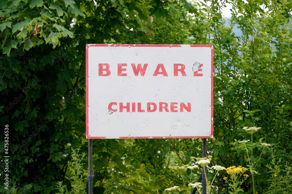 Beware children safety sign on road for drivers