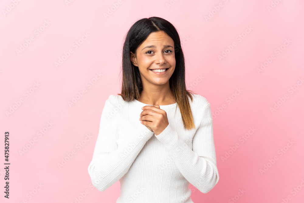 Caucasian girl isolated on pink background laughing Caucasian girl isolated on pink background laughing
