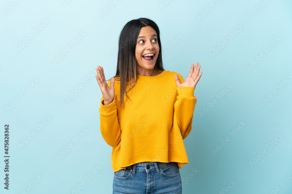 Caucasian girl isolated on blue background with surprise facial expression Caucasian girl isolated on blue background with surprise facial expression