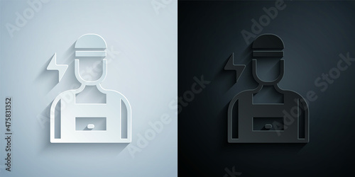 Paper cut Electrician technician engineer icon isolated on grey and black background. Paper art style. Vector