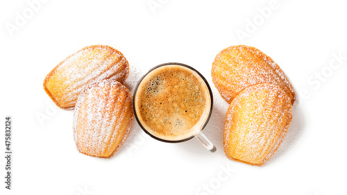 Perfect French madeleine cookies, buttery and delicate, powdered with icing sugar served with cup of coffee. Isolated on white background. Top view