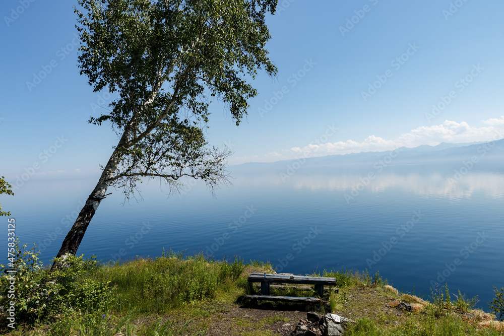 Resting place on the shore of Lake Baikal. Hiking resting place with campfire place and table.