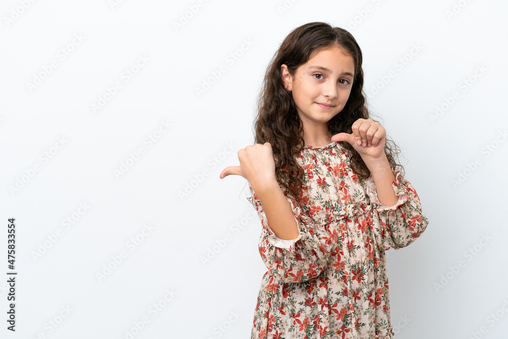 Little caucasian girl isolated on white background pointing to the side to present a product Little caucasian girl isolated on white background pointing to the side to present a product