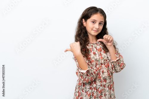Little caucasian girl isolated on white background pointing to the side to present a product