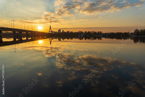 Sunset view Pivnichnyi Northern Bridge on river in Kyiv, Ukraine