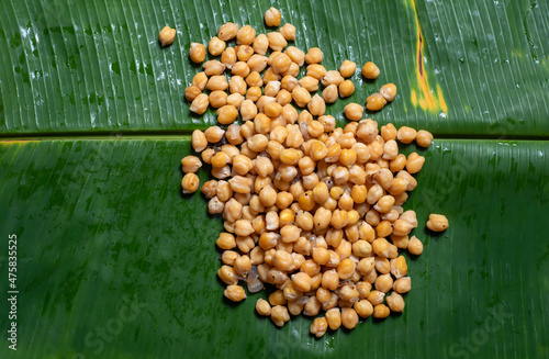 South Indian Snacks Chickpea Sundal on Banana Leaf. This is a festive and healthy diet food. It is very popular for the South Indian festival Ganesha Chaturthi and Ayutha Poojai. photo
