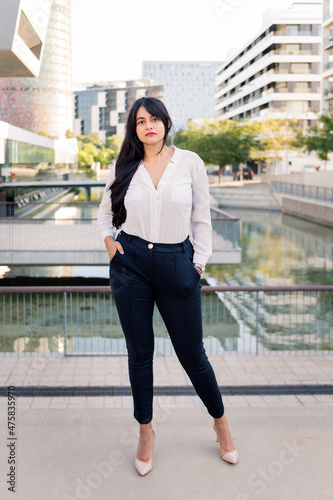 successful curvy businesswoman serious in the city