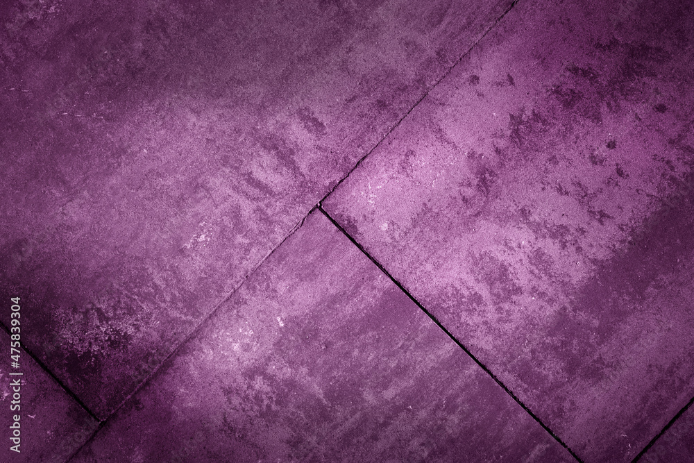 Stone pedestrian walkway patter in purple color. Abstract architectural background and texture for design.