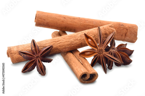 Spicy cinnamon sticks and anise stars isolated on white