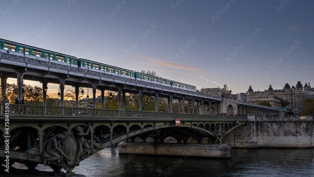 Metro passing by on the bridge in Paris