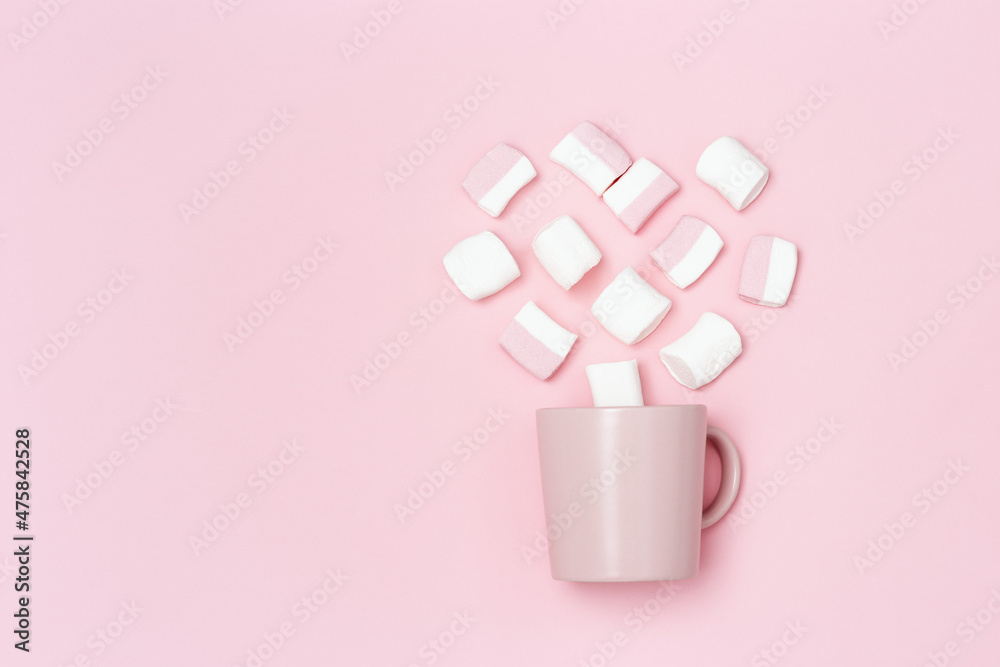 Romance holiday concept, pink mug or cup and marshmallows in shape of heart, declaration of love