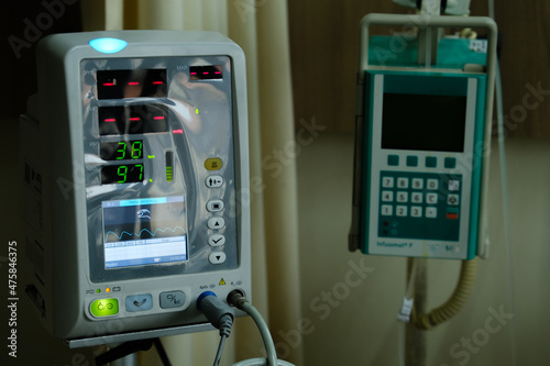 Selective focus picture with noise effect added of vital sign monitor used in a paediatric ward. photo