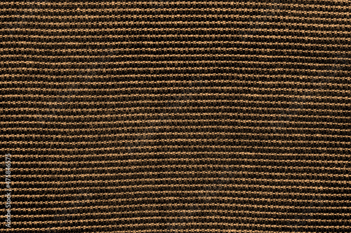 Golden color woolen fabric texture background with abstract pattern