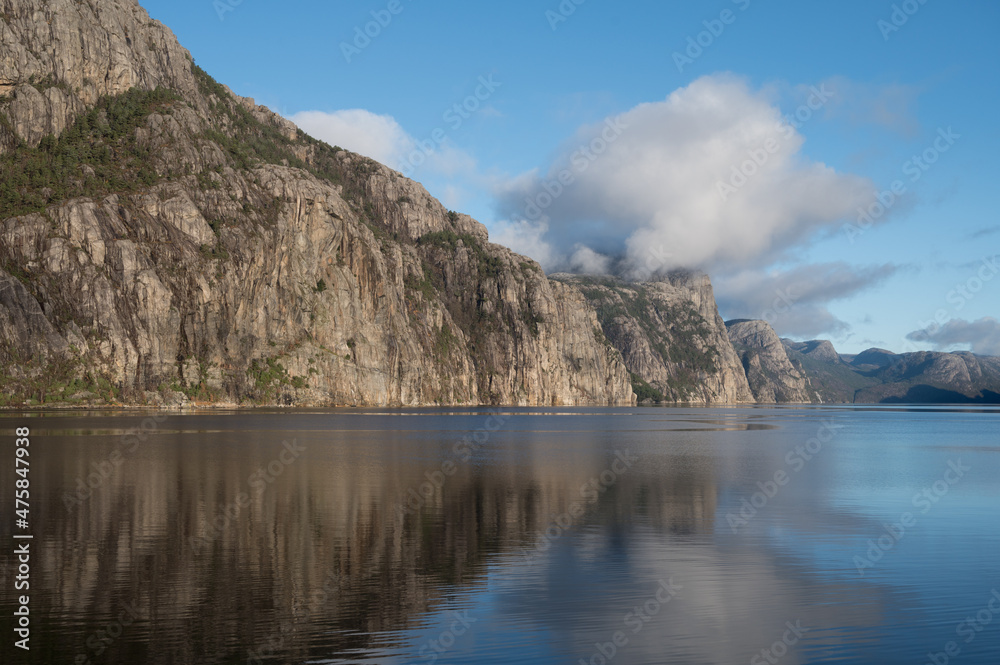 Scenic landscape of beautiful nature of Norway at sunny day. Huge rocks and fjord.