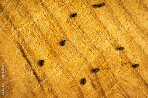 black sezam seeds on wooden cutting board after sushi preparation photo