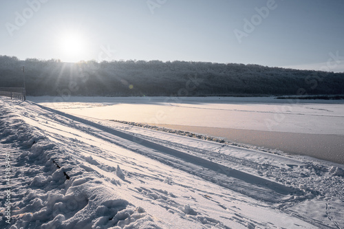 December winter sun over a frozen river