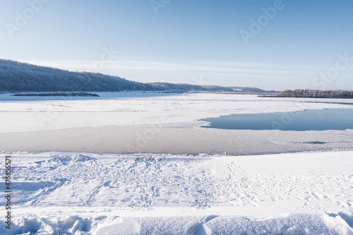 Winter wide landscape on a frozen river