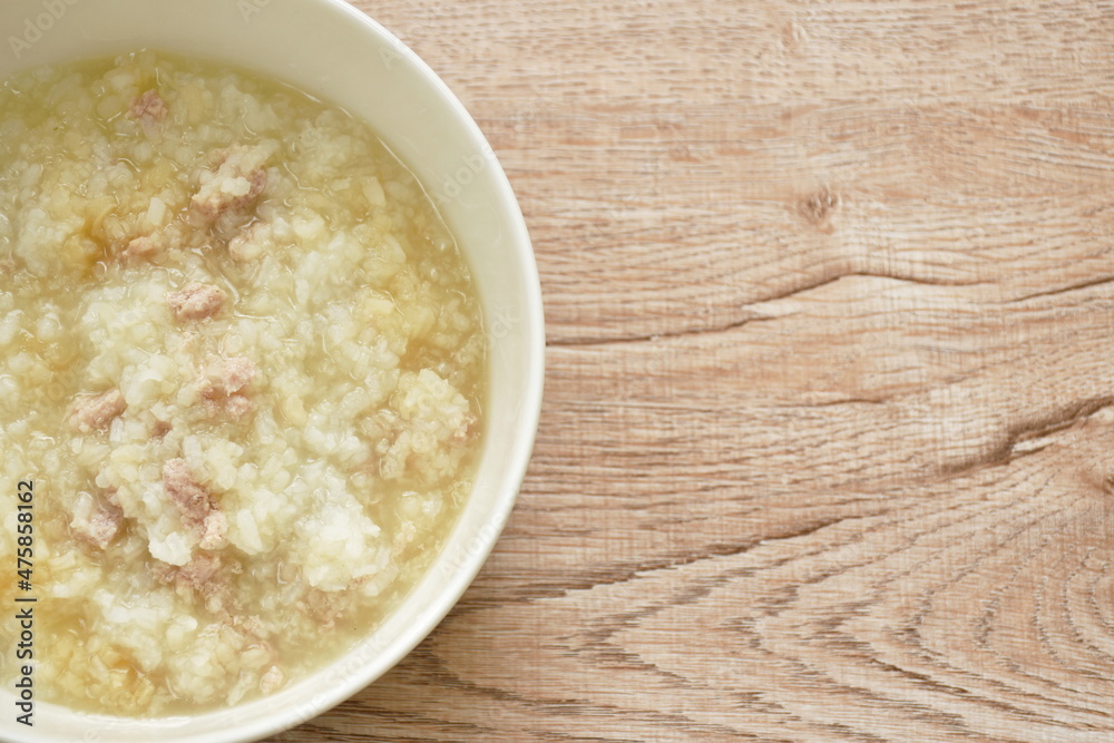 rice porridge with chop pork dressing soy sauce soup on bowl rice porridge with chop pork dressing soy sauce soup on bowl