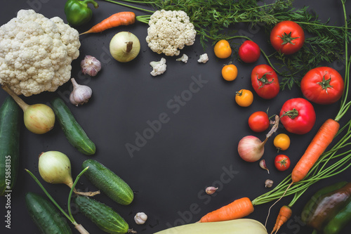 Vegetables on a dark background. Vegetables from the garden. Natural healthy food.