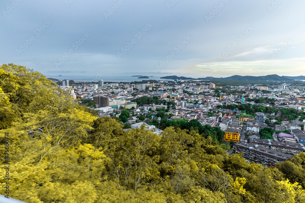 Panoramic view old phuket town viewed from Khaorang Hill and in the distance is Challong Bay and the islands big Buddha and Rawai Phuket Thailand