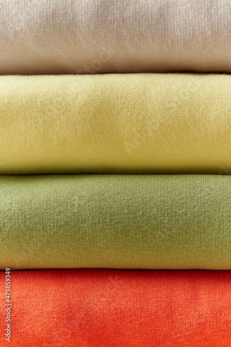 close-up view of cashmere sweaters stacked on top of each other. autumn mood.