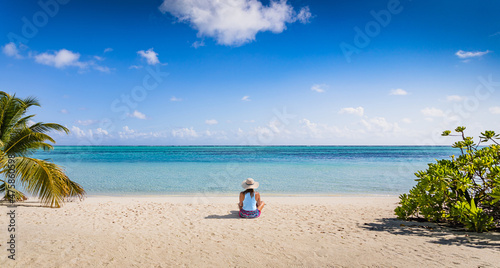 A girl during vacations on a paradise beach on an island with turquoise water - Maldives © guteksk7