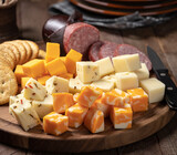 Cheese platter with sausage and crackers