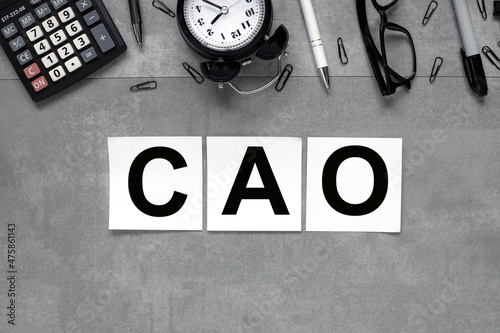 CAO. text on white stickers on gray marble background business concept photo