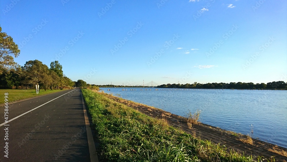 lakeside cycling road in the sunny day