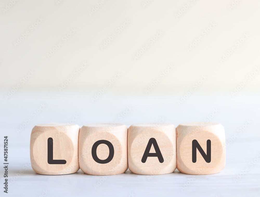 Wooden cube with LOAN text. Business concept. Wooden cube with LOAN text. Business concept.