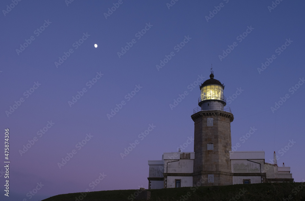 The moon over the lighthouse of Matxitxako, Bizkaia