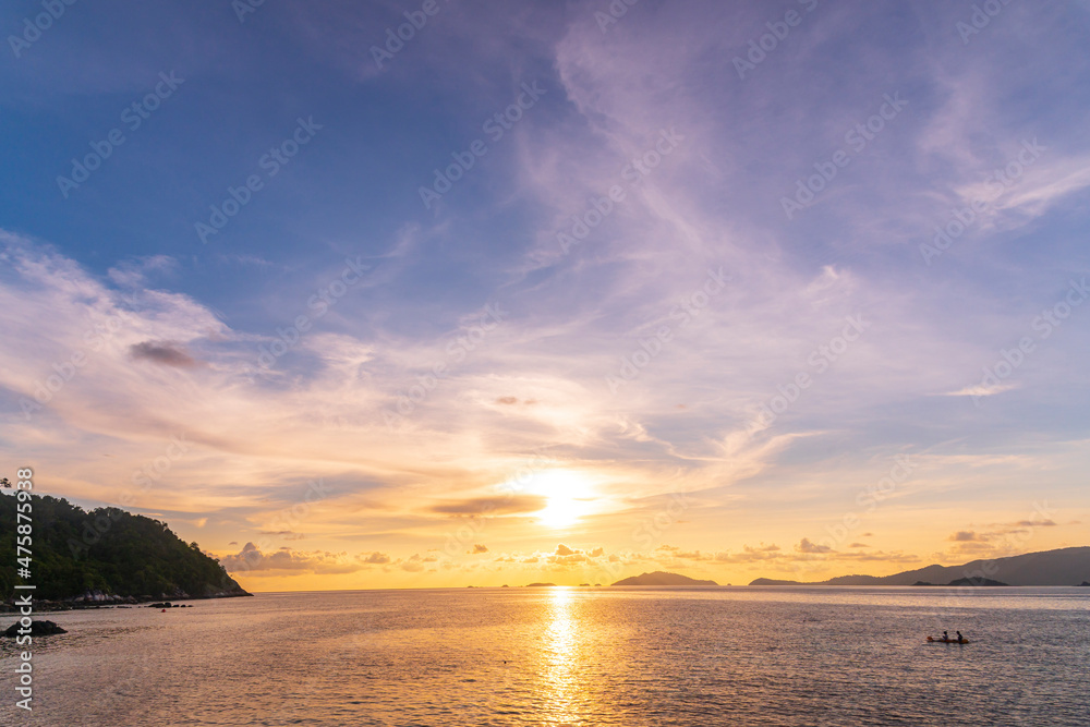 Beautiful gold sunset of reflection on sea wave with skyline background, summer twilight landscape