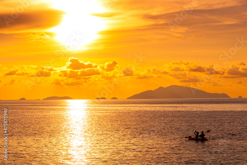 Beautiful gold sunset of reflection on sea wave with skyline background, summer twilight landscape