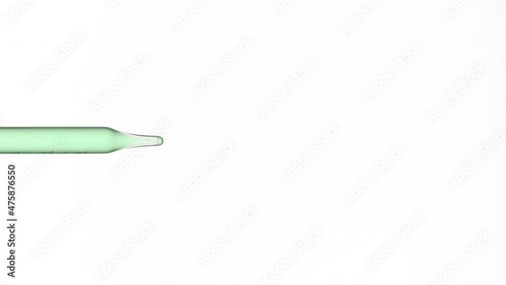 Macro shot of green drop is dripping from lab dropper on white background | Abstract body care lotion ingredients formulation concept Macro shot of green drop is dripping from lab dropper on white background | Abstract body care lotion ingredients formulation concept