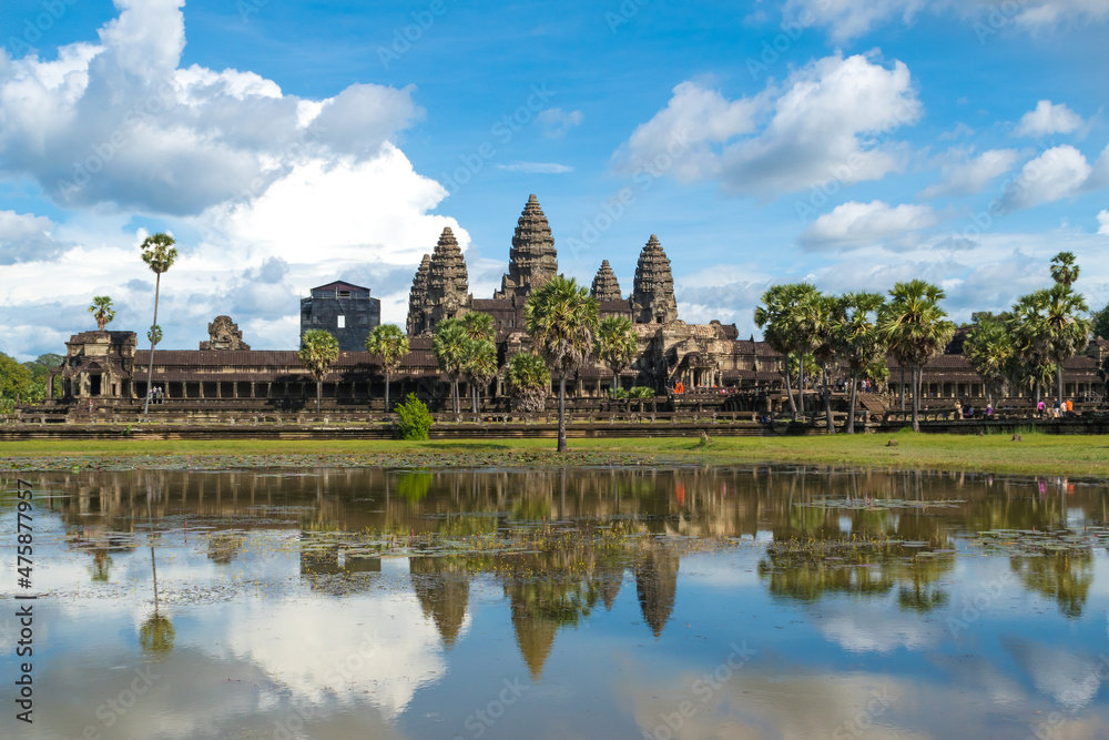 Angkor Wat, Siem Reap, Cambodia - a beautiful view of the most famous Khmer temple in Cambodia, reflected in water Angkor Wat, Siem Reap, Cambodia - a beautiful view of the most famous Khmer temple in Cambodia, reflected in water